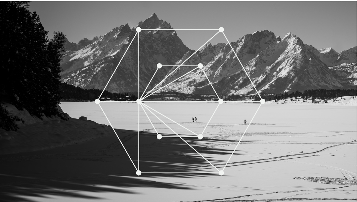 Black and white photo of Grand Teton Mountain from Jackson Lake, Wyoming, overlaid with a graphic.