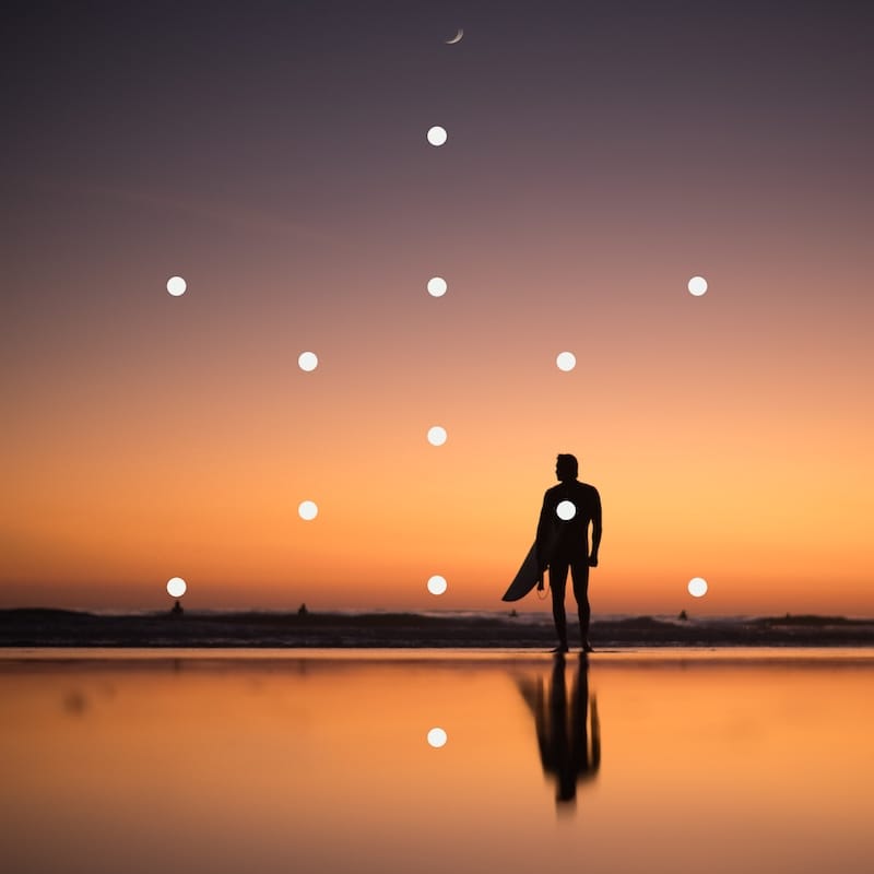A surfer at sunset