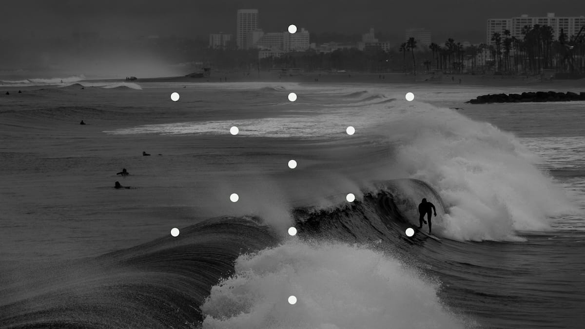 A surfer riding waves in a storm, January 2026, Venice Beach
